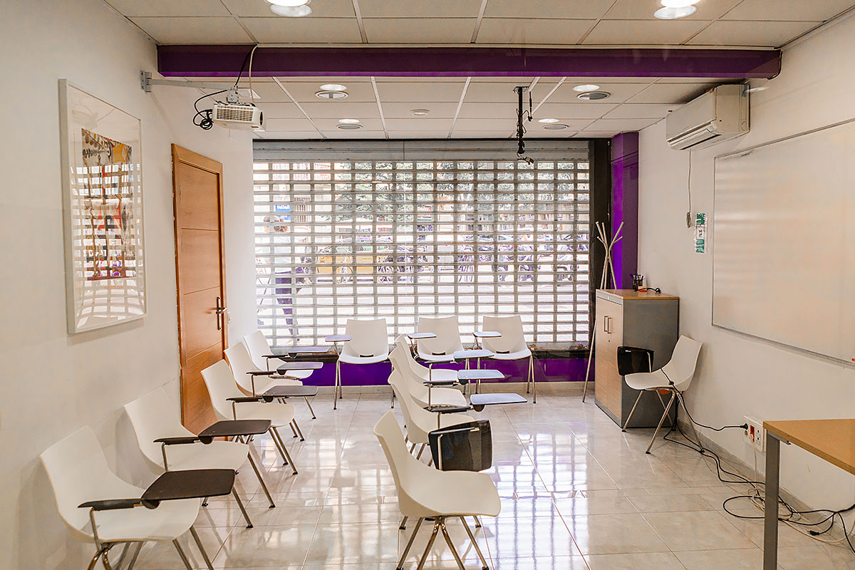 Classroom at Sunlight School in Barcelona with comfortable chairs and an interactive whiteboard