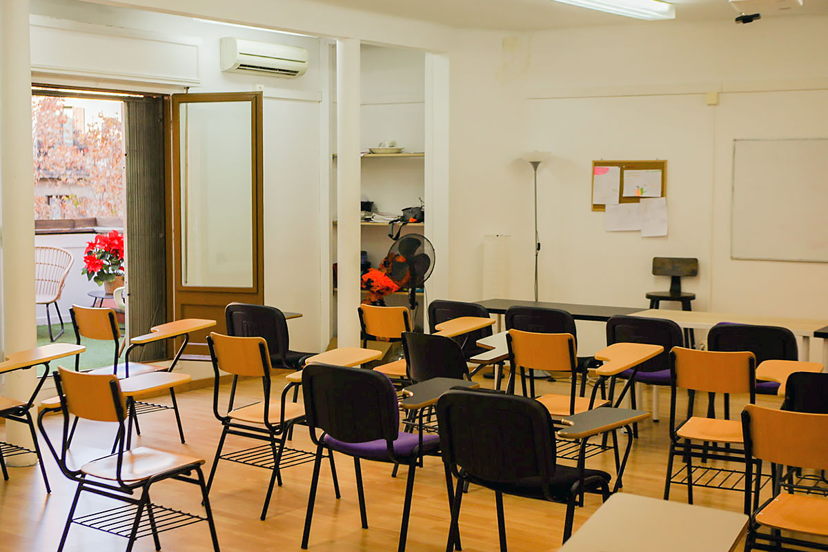 Classroom at Sunlight Language School in Barcelona with comfortable desks and access to the terrace